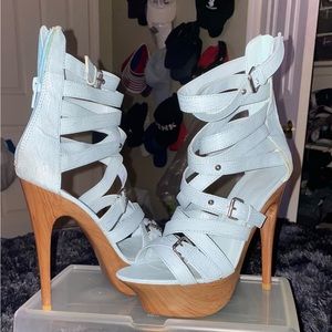 Powder blue strapped stelletto heels. Slightly scratched on bottom. Size 7